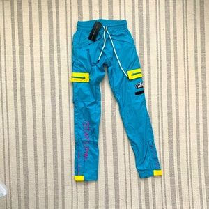 Tulones track pants. Currency Collectors. Size S.